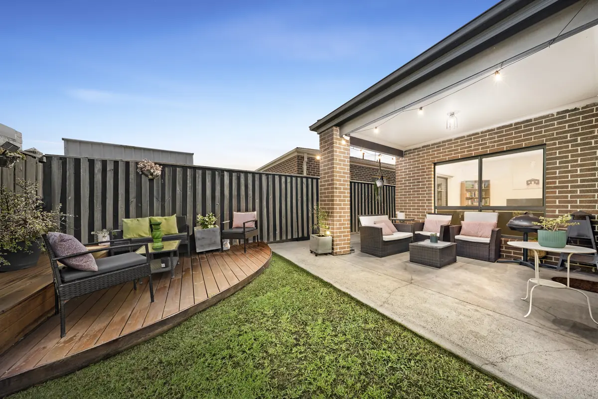 Covered alfresco terrace glowing at dusk &mdash; real estate photography Melbourne