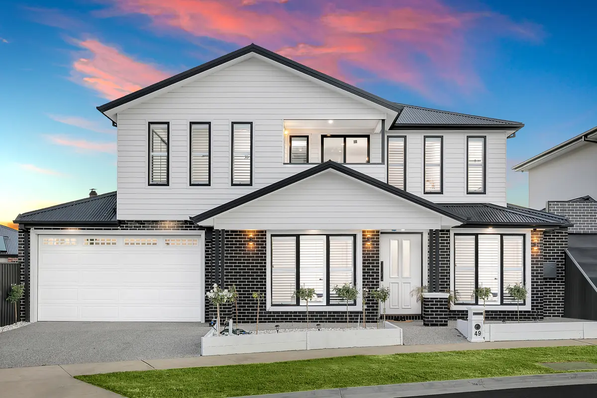 Hamptons weatherboard two-storey at dusk &mdash; real estate photography Melbourne