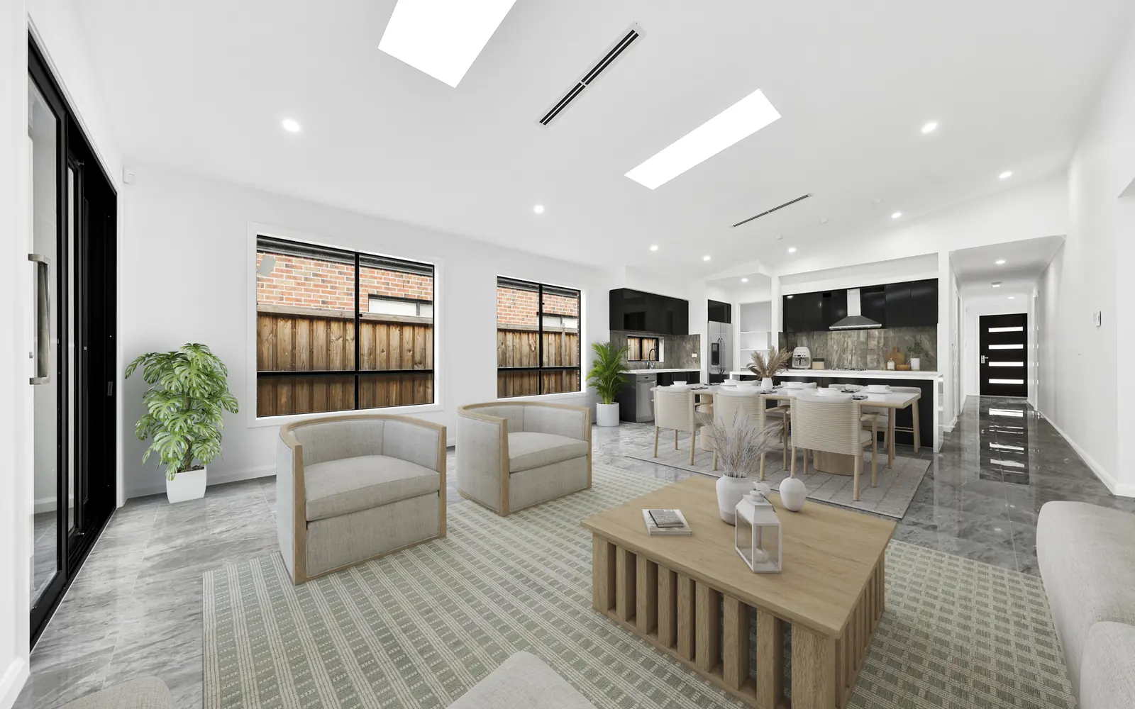 The same room virtually staged with lounge chairs, dining and styling — real estate photography Melbourne